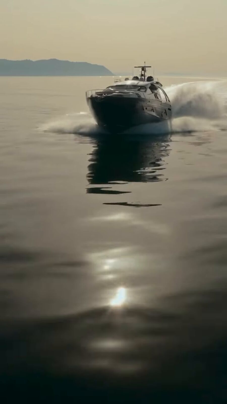 Yacht running at golden hour