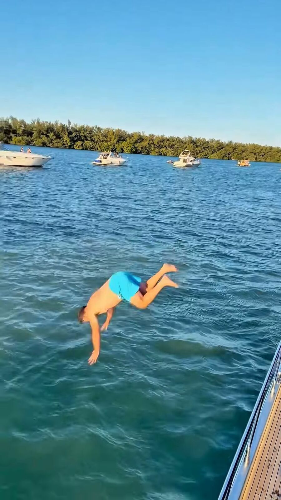 Guest jumping off the yacht into the water