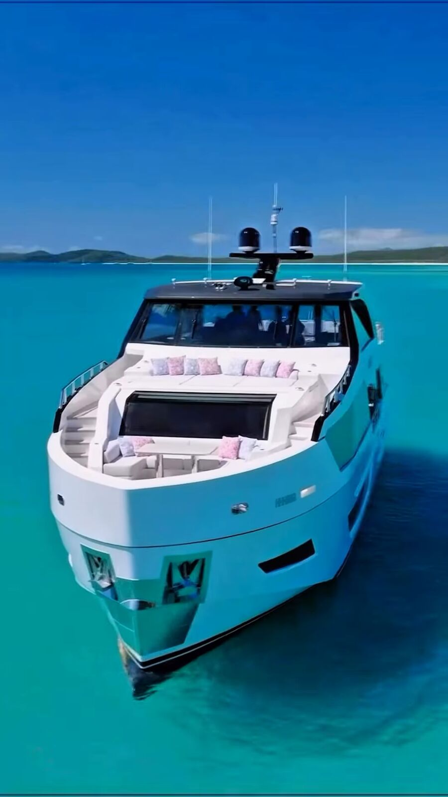 Yacht anchored in turquoise water